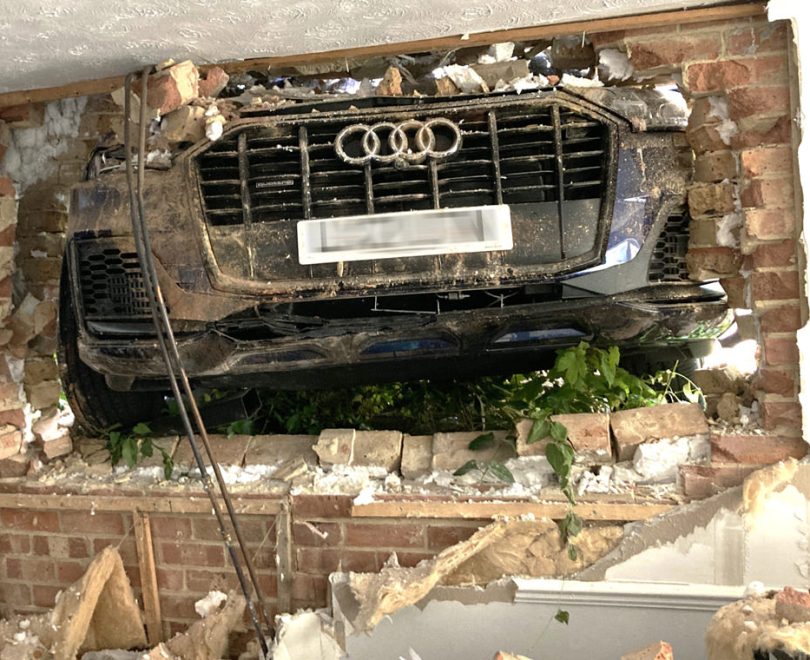 Car crashes into a building and causes structural damage