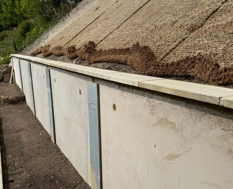 Retaining wall solution behind a row of British cottages